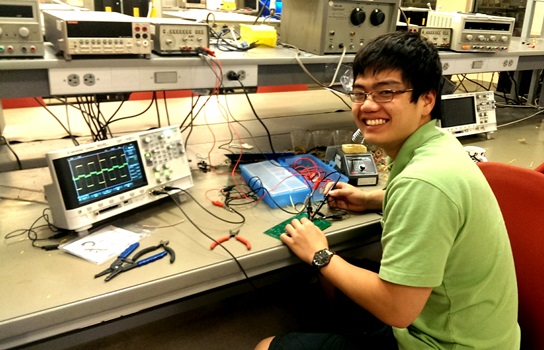 Undergraduate student Kei Hitomi working on PCB-level hardware Trojan