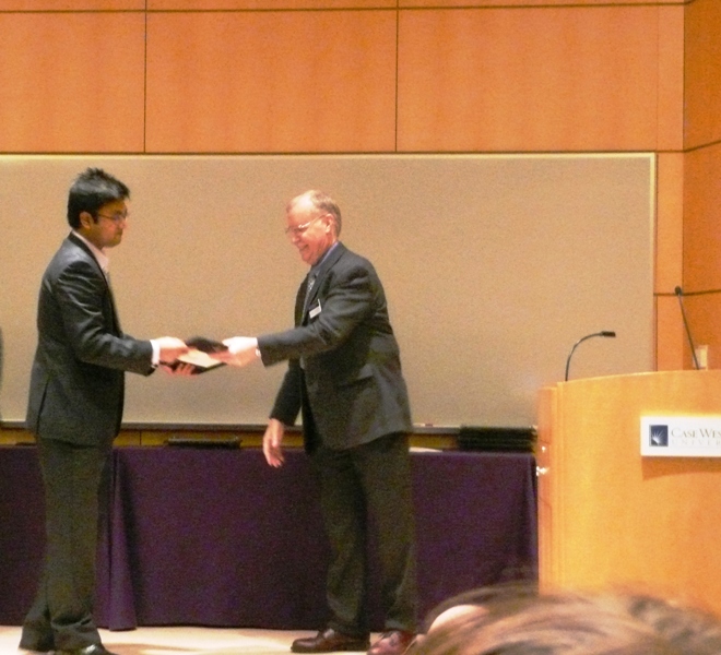 Xinmu Wang accepts the 3rd prize in CSAW 2010 competition